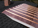 East shed dormer copper roof tb