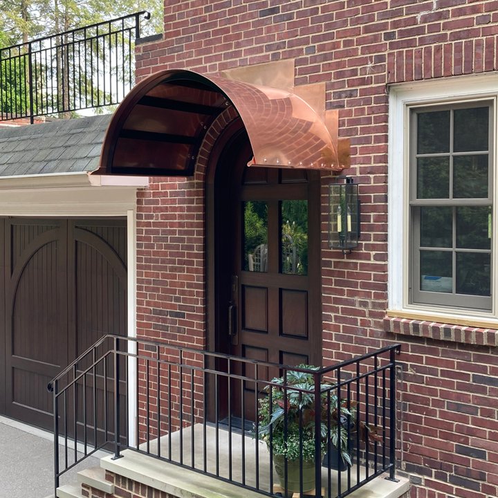 Custom copper roof awning over side entry 
