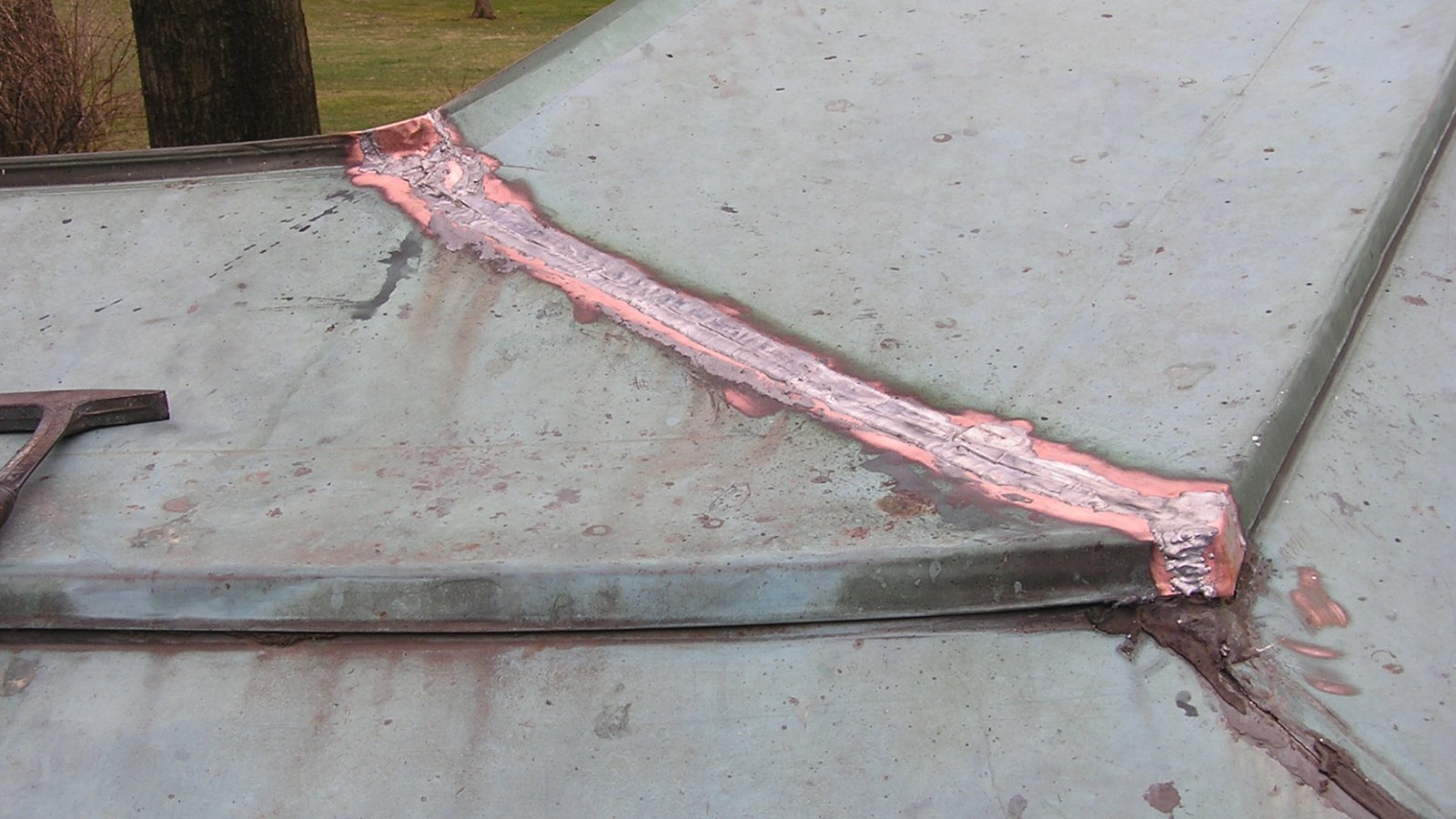 Copper flat seam roof repair after soldering